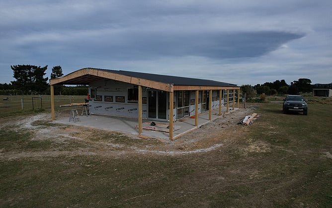 The Oxford shed home wrapped and roofed with the verandah posts in place, before the cladding went on