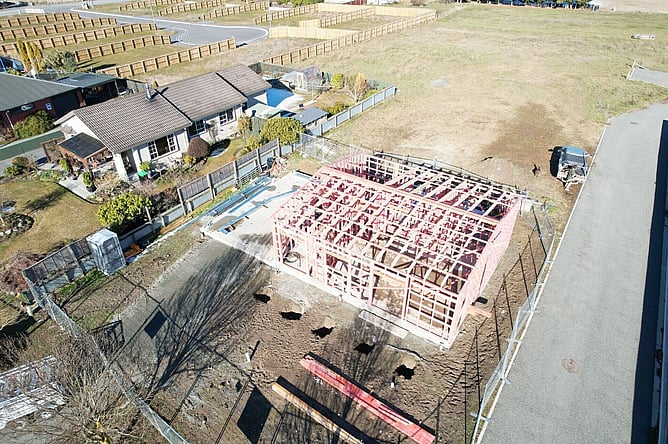 Aerial of the red-primed framing on the compact Fairlie section, with the neighbouring house close alongside