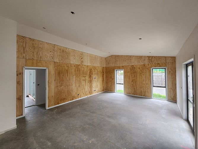 Plywood-lined living room in the Fairlie bach before the flooring went in