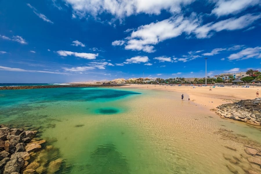 Sheltered golden sand beach and turquoise sea in Fuerteventura