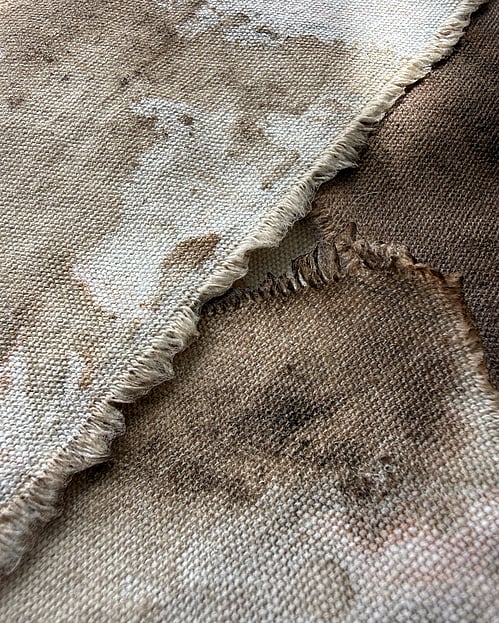 detail image of repurposed oat-toned cotton fragments, hand-dyed in sepia-toned acrylic ink