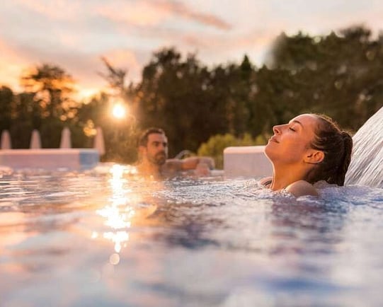 Couple enjoying a thermal soak at the Hanmer Springs Thermal Pools