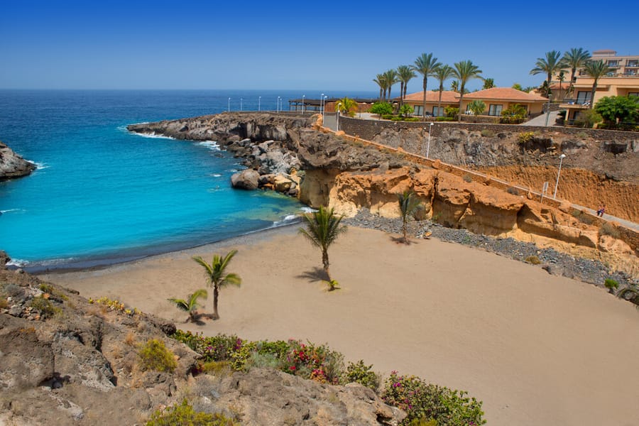Sandy cove and clear sea on the coast near Playa Paraíso, Tenerife