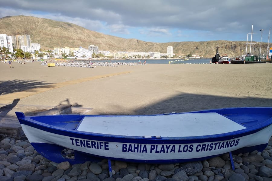Fishing boat on the beach by the harbour in Los Cristianos, Tenerife
